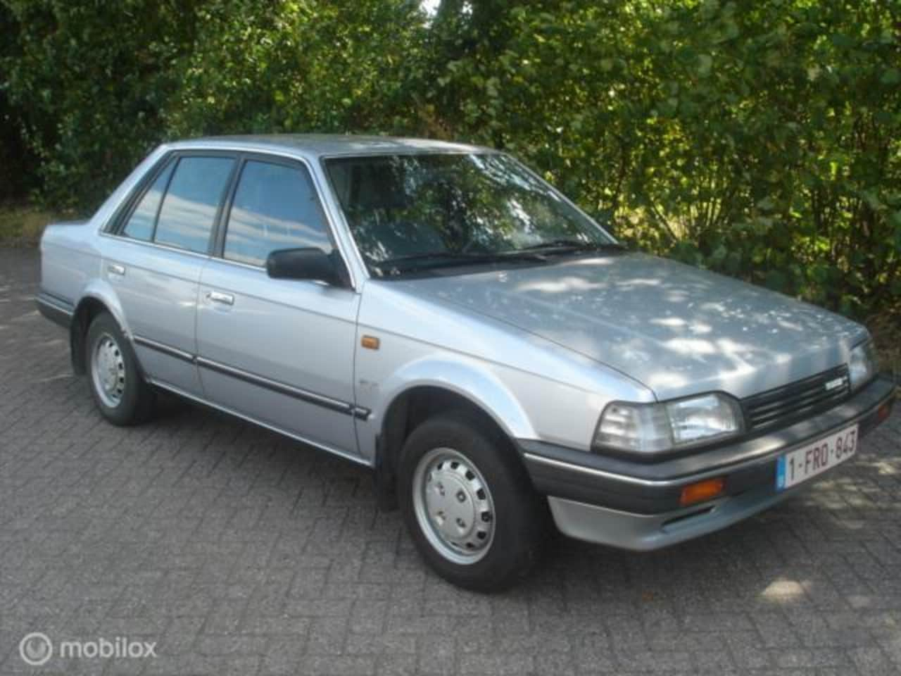 Mazda 323 - 1.5 GLX 4 drs. sedan - AutoWereld.nl