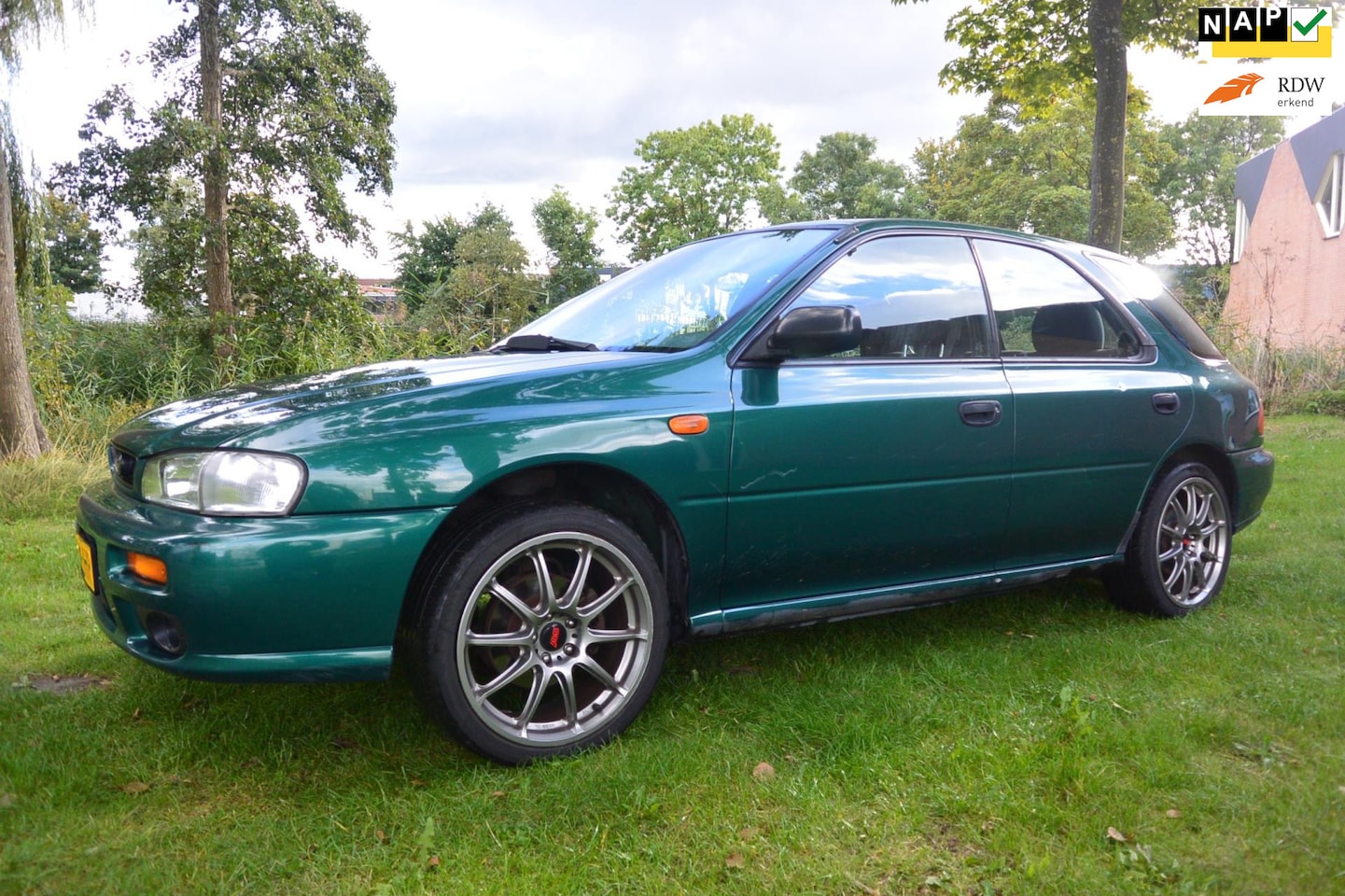 Subaru Impreza Plus - Station wagon 1.6 GL AWD - AutoWereld.nl