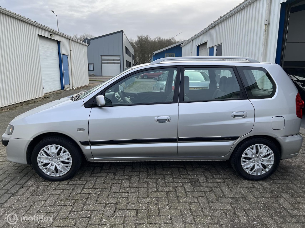 Mitsubishi Space Star - 1.6 Invite Silver |Airco|APK 01-2024 - AutoWereld.nl