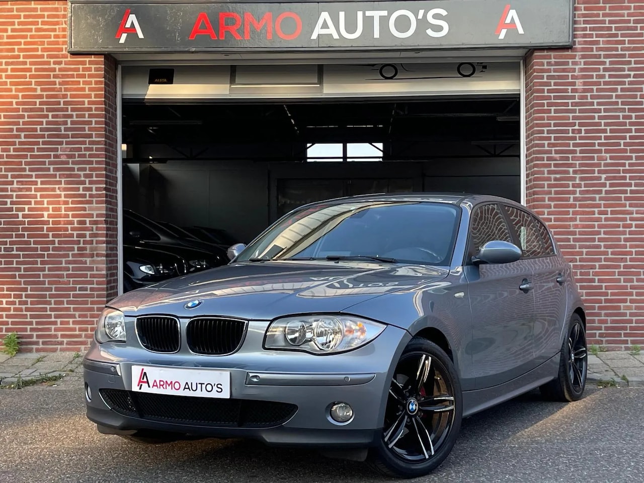 BMW 1-serie - 118i High Executive | Airco | Cruise | Navi - AutoWereld.nl