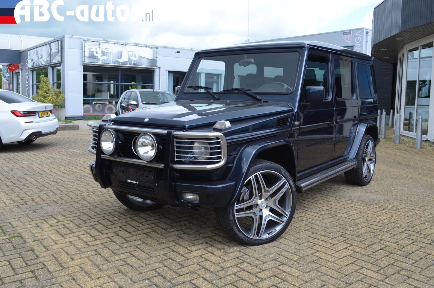 Mercedes-Benz G-klasse - 320/V6 AMG uitv. 9 persoons - AutoWereld.nl