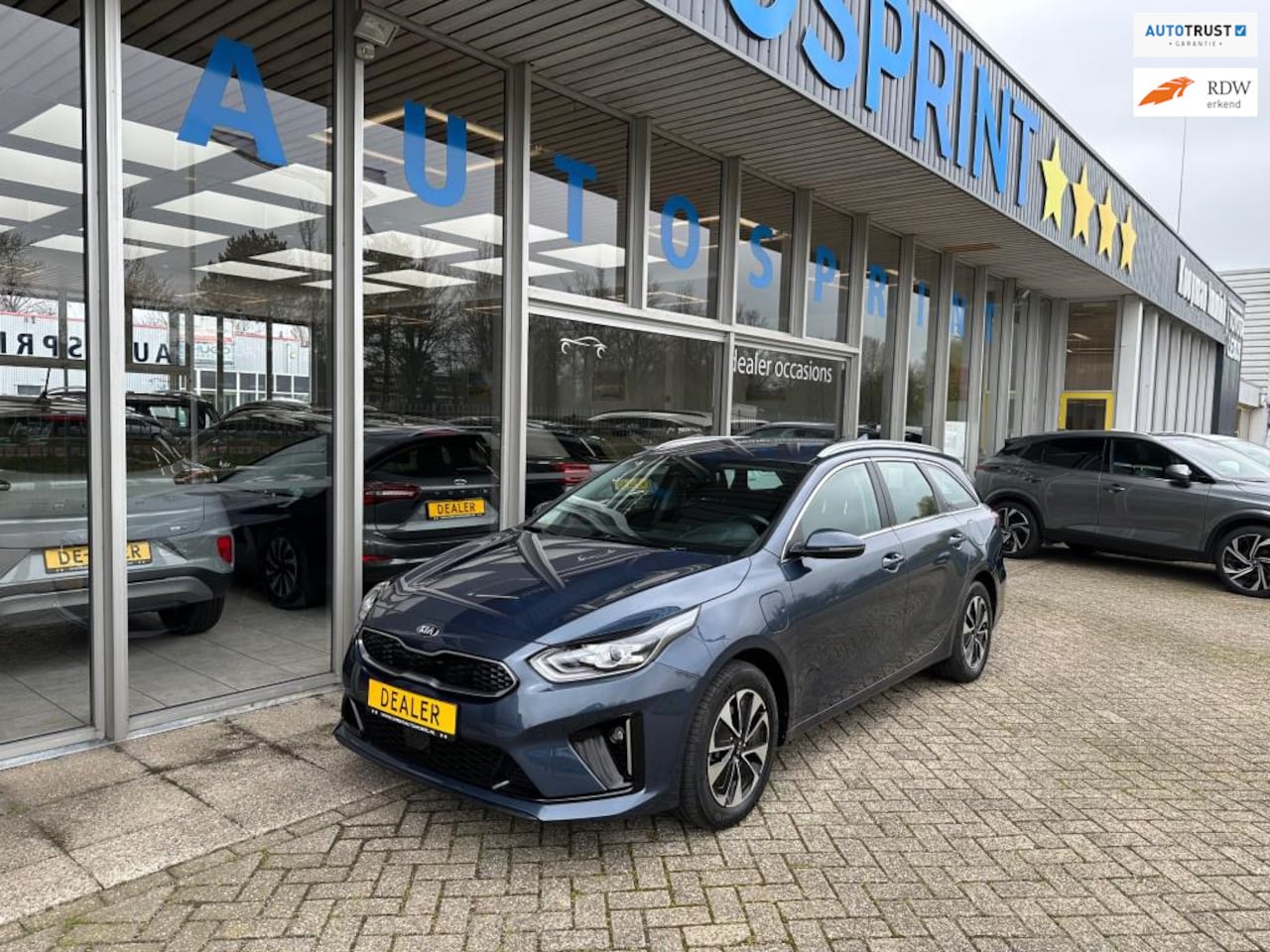 Kia Cee'd Sportswagon - 1.6 GDI PHEV DynamicLine 140PK AUTOMAAT / CARPLAY / ACHTERUITRIJCAMERA / CRUIECONTROL - AutoWereld.nl