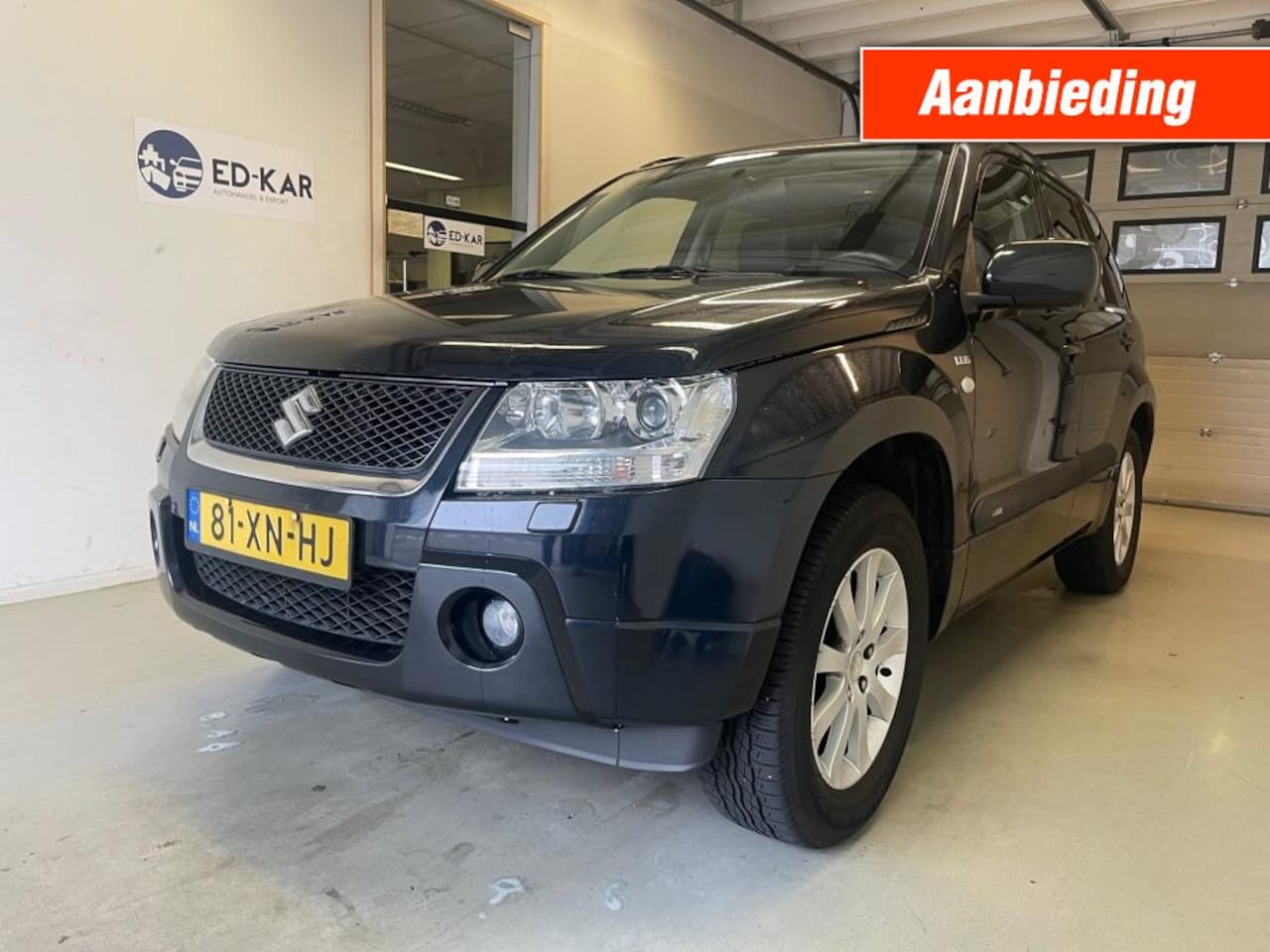 Suzuki Grand Vitara - 1.9 High Executive 4WD LEER NAVI CAMERA 1STE EIGENAAR NAP APK - AutoWereld.nl