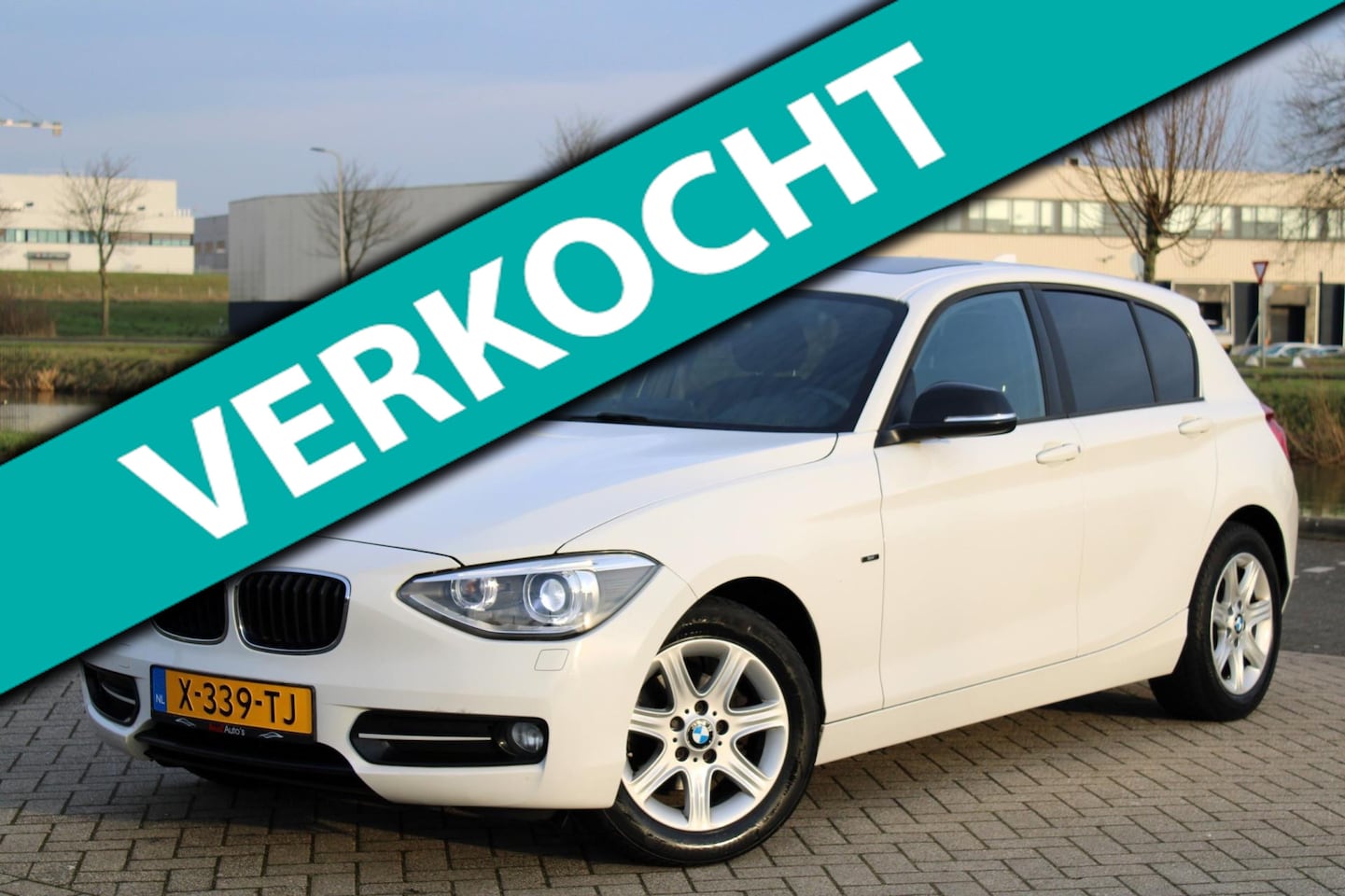 BMW 1-serie - 116i Sport l Airco l Schuifdak l Navi l Xenon - AutoWereld.nl