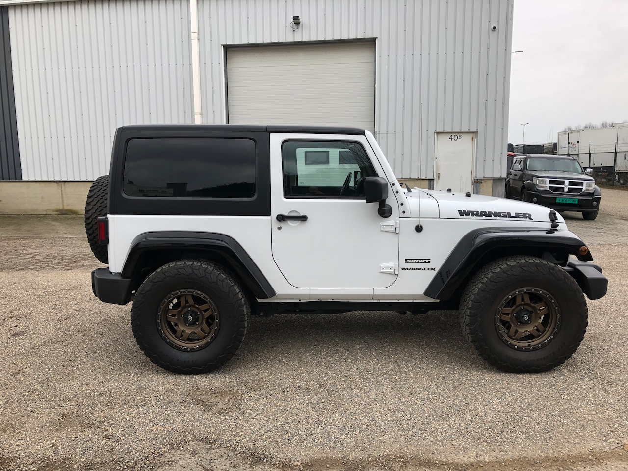 Jeep Wrangler - 3.6 Mountain Sport uitvoering - AutoWereld.nl