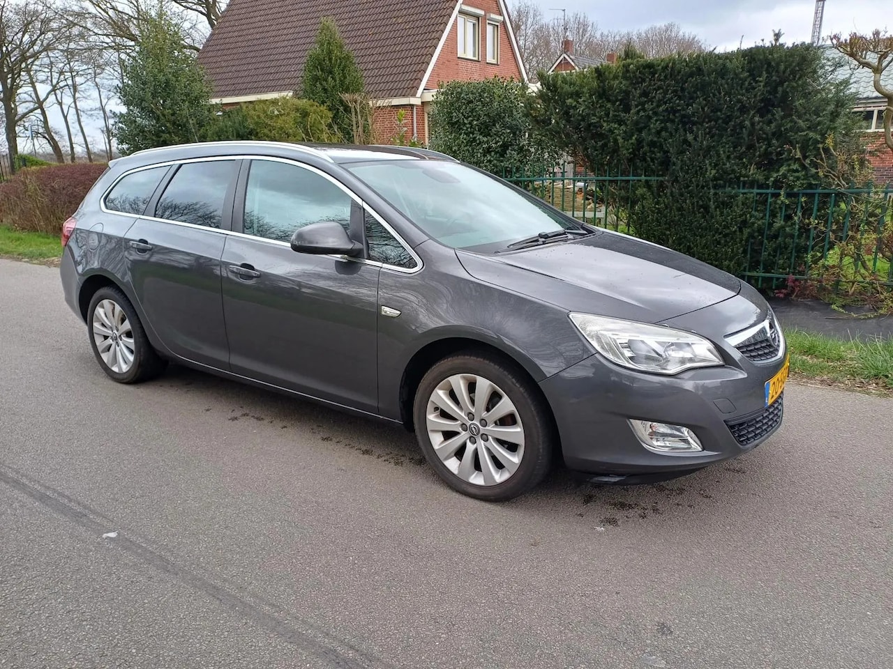 Opel Astra Sports Tourer - 1.4 Cosmo 1.4 100pk Cosmo - AutoWereld.nl