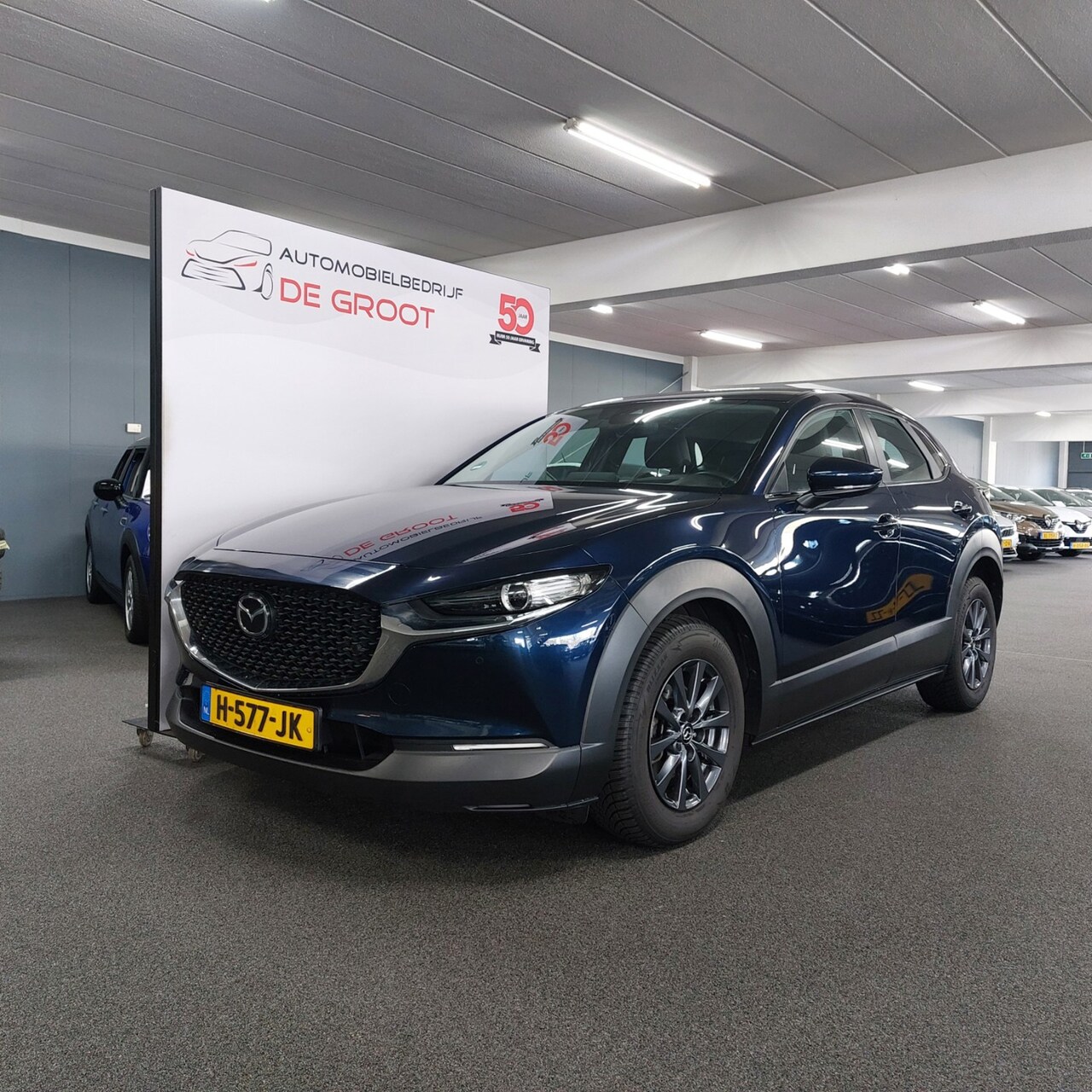 Mazda CX-30 - 2.0 e-SkyActiv-G M Hybrid Comfort-CAMERA-ELEC ACHTERKLEP-LEER - AutoWereld.nl