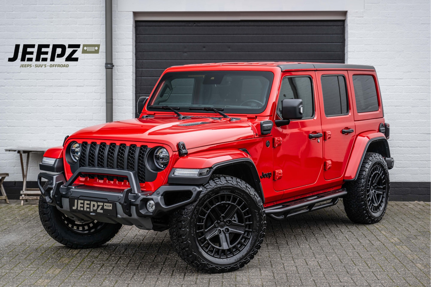 Jeep Wrangler Unlimited - 4xe 380 Sahara - 20" Lmv - Ofd Bumpers - Side bars - AutoWereld.nl