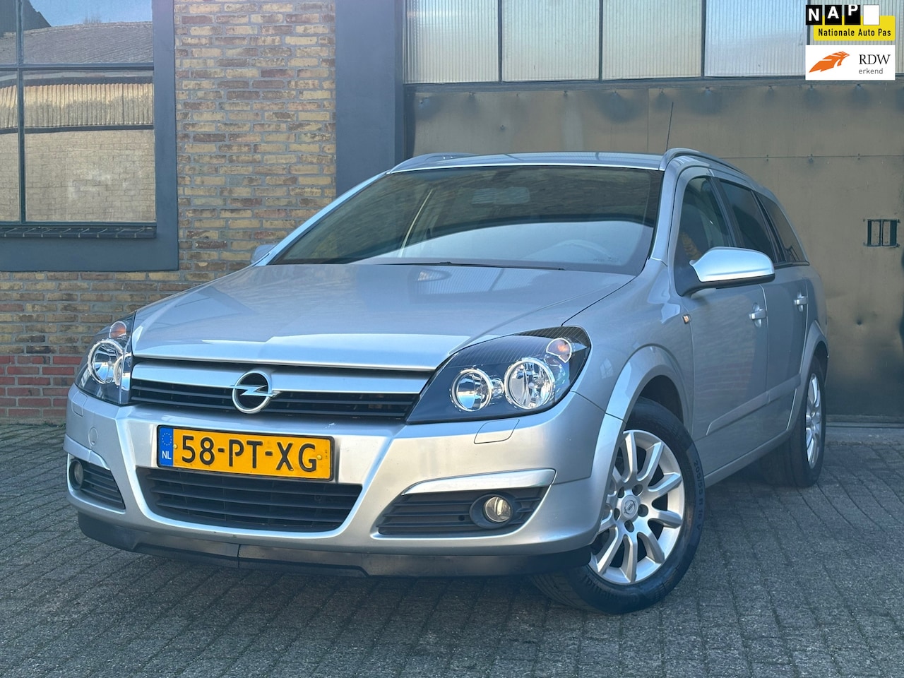 Opel Astra Wagon - 1.4 Enjoy Airco+Cruise Control - AutoWereld.nl