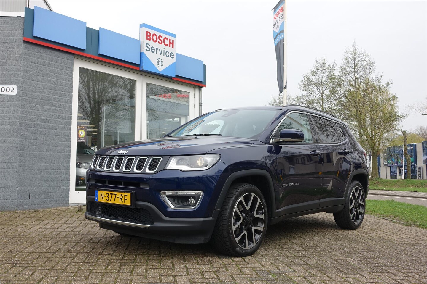 Jeep Compass - 1.4 MultiAir 140pk Limited | HALF LEDER | NAVI | ECC | KEYLESS - AutoWereld.nl