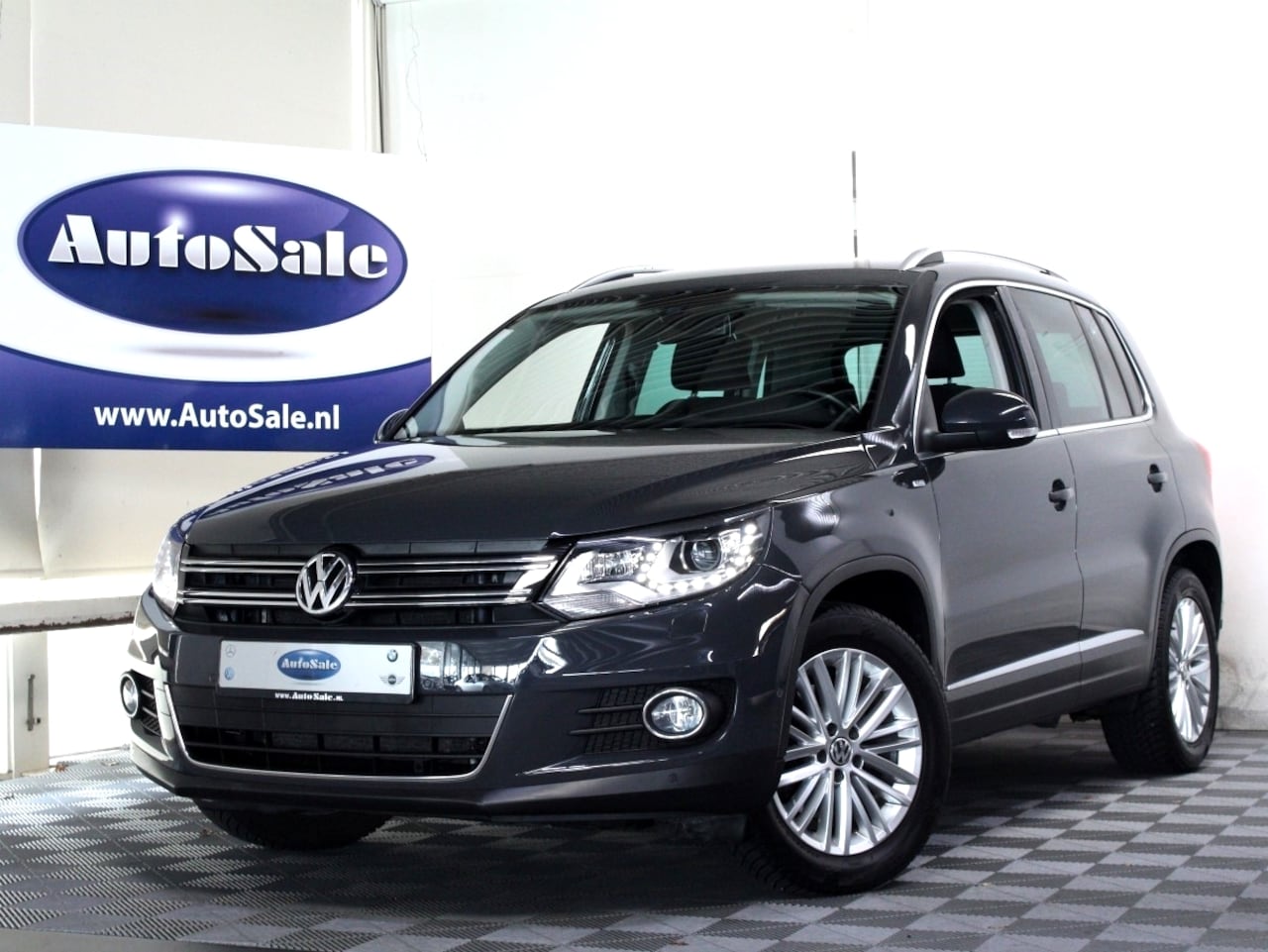 Volkswagen Tiguan - 1.4 TSI DSG 160pk Sport&Style NAVI BT XENON STOELVW '14 - AutoWereld.nl