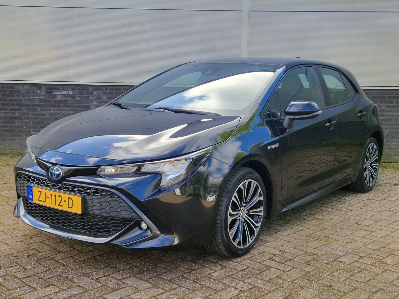 Toyota Corolla - 1.8 Hybrid First Edition Trekhaak Navigatie - AutoWereld.nl