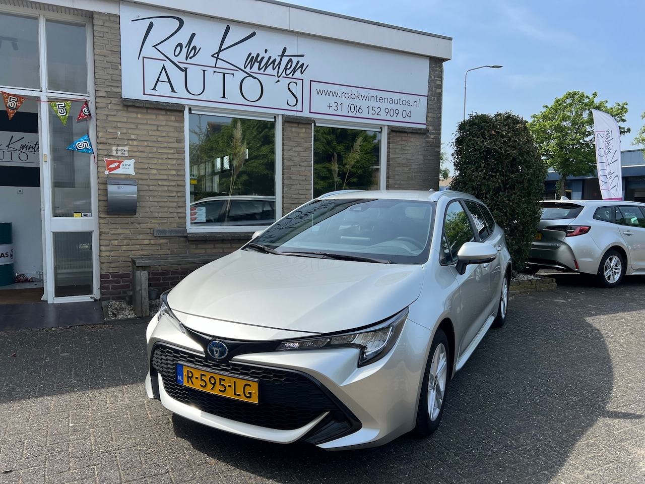 Toyota Corolla Touring Sports - 1.8 Hybrid Active Automaat - AutoWereld.nl