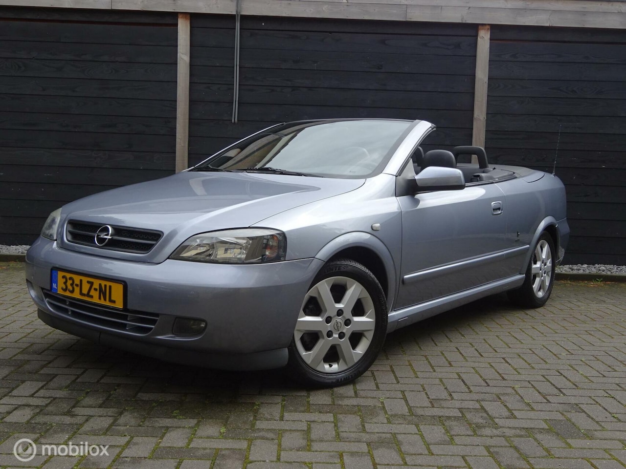 Opel Astra Cabriolet - 2.2-16V Young Timer / Lederen stoelen / Clima/ 80.678 KM NAP !!! ned auto - AutoWereld.nl