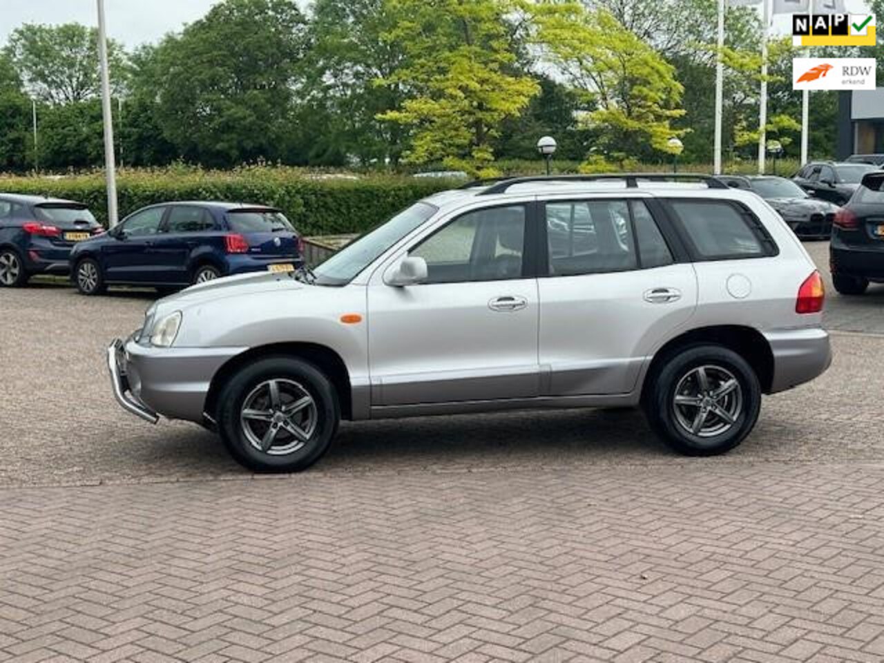 Hyundai Santa Fe - 2.0i-16V Motion 2.0i-16V Motion,bj.2004,kleur:grijs,APK tot 06/2025 en NAP met 215158 km.trekhaak,climate - AutoWereld.nl