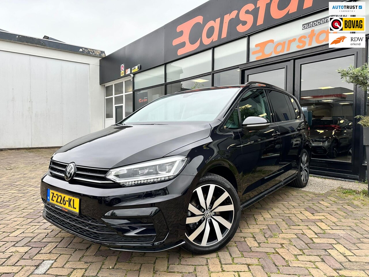 Volkswagen Touran - 1.5 TSI Highline 7p|CAM|PDC|TREKHAAK - AutoWereld.nl