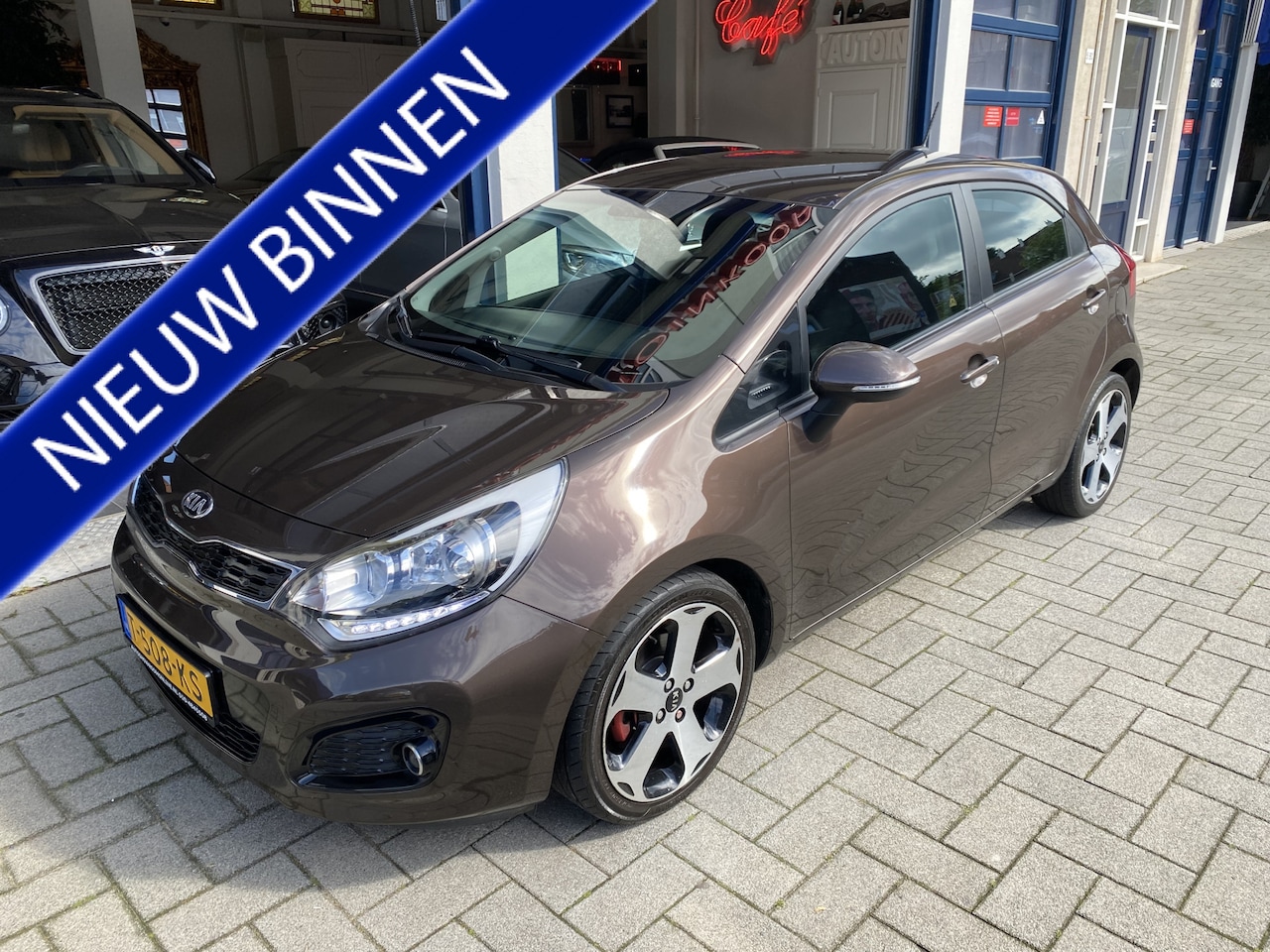 Kia Rio - 1.4 CVVT Plus Pack AUTOMAAT/NAV/CLIMA/CAMERA/CRUISE - AutoWereld.nl