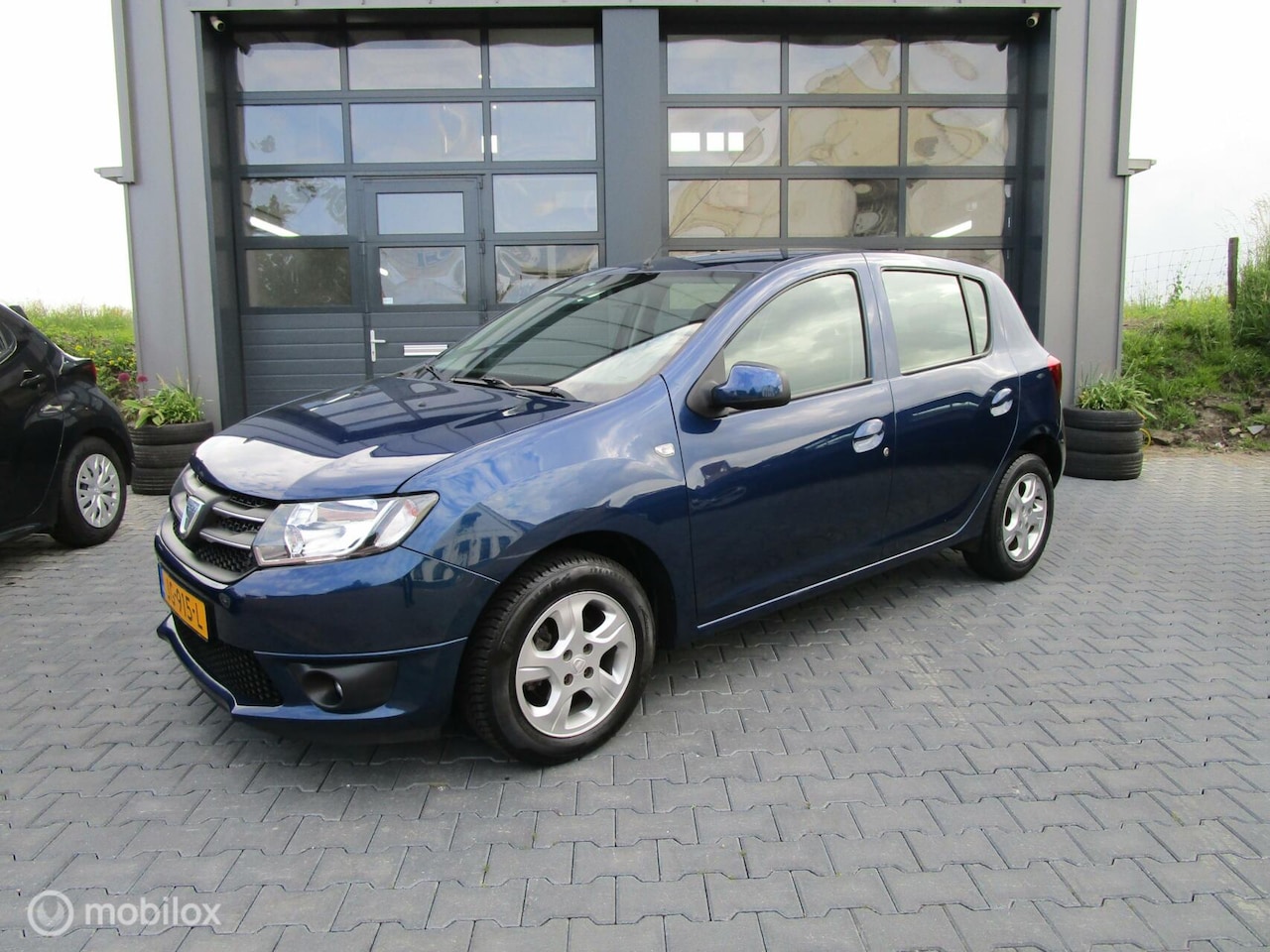 Dacia Sandero - 0.9 TCe Easy-R Lauréate 5drs Aut Airco Trekhaak - AutoWereld.nl