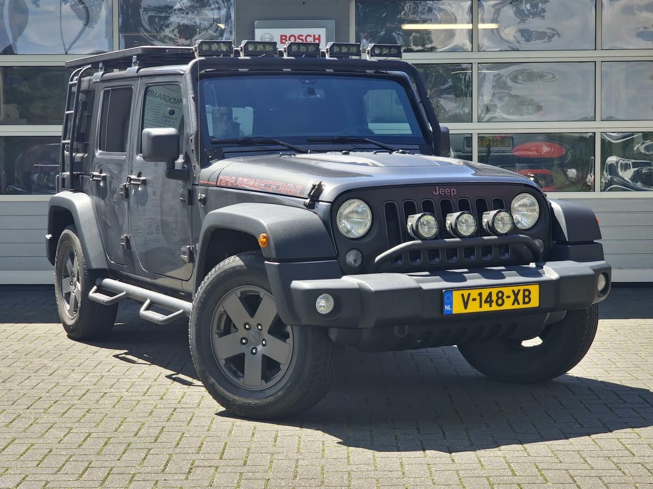 Jeep Wrangler - 2.8 CRD Rubicon|Marge|Roofrack|sidebars|LED-bars|carplay|Camera|grijskenteken| - AutoWereld.nl