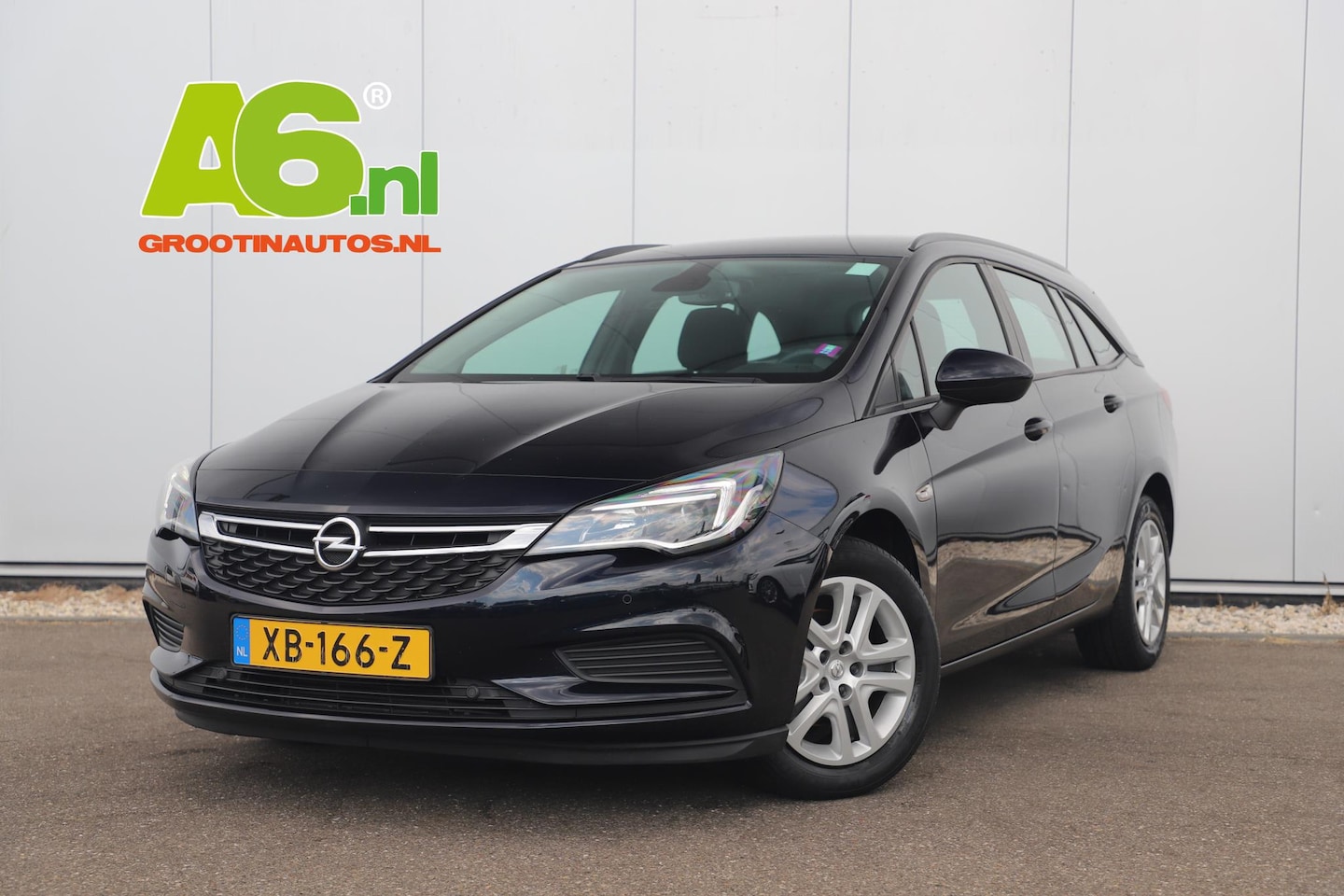 Opel Astra Sports Tourer - 1.0 Business Executive Navigatie Clima Cruise PDC Bluetooth Metallic DAB+ - AutoWereld.nl