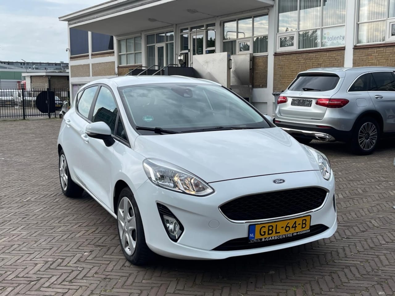 Ford Fiesta - 1.1 Trend Cruise|Airco|Navi|Carplay - AutoWereld.nl