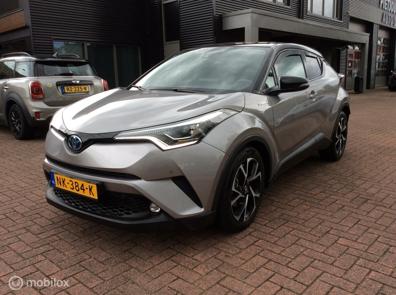 Toyota C-HR - 1.8 Hybrid Bi-Tone org Ned Nav Camera Leder Nap 18" - AutoWereld.nl