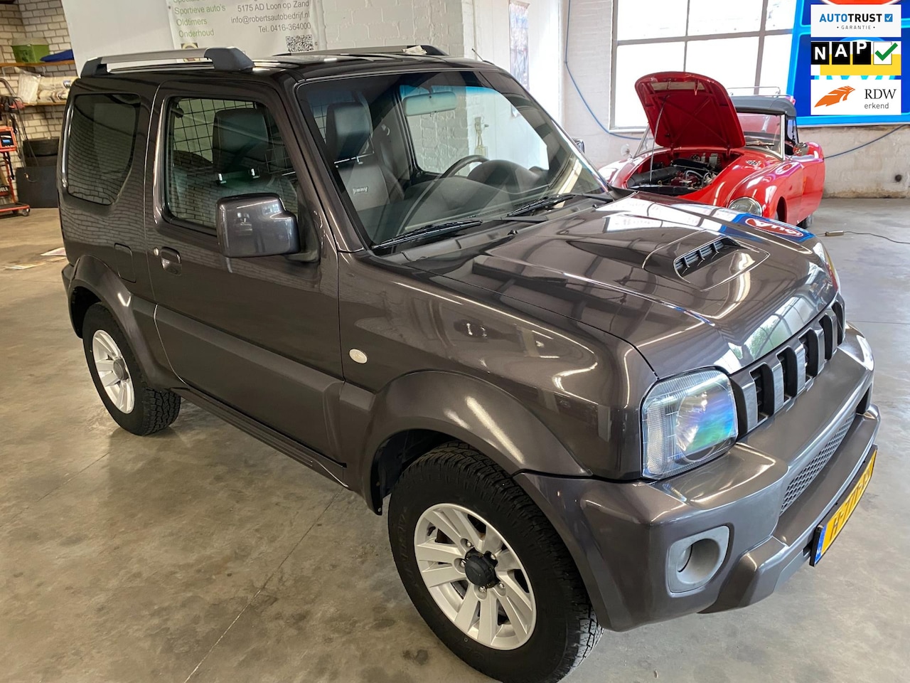 Suzuki Jimny - 1.3 ExclusiveLEDER, AIRCO, LAGE KM STAND LM WIELEN ETC - AutoWereld.nl