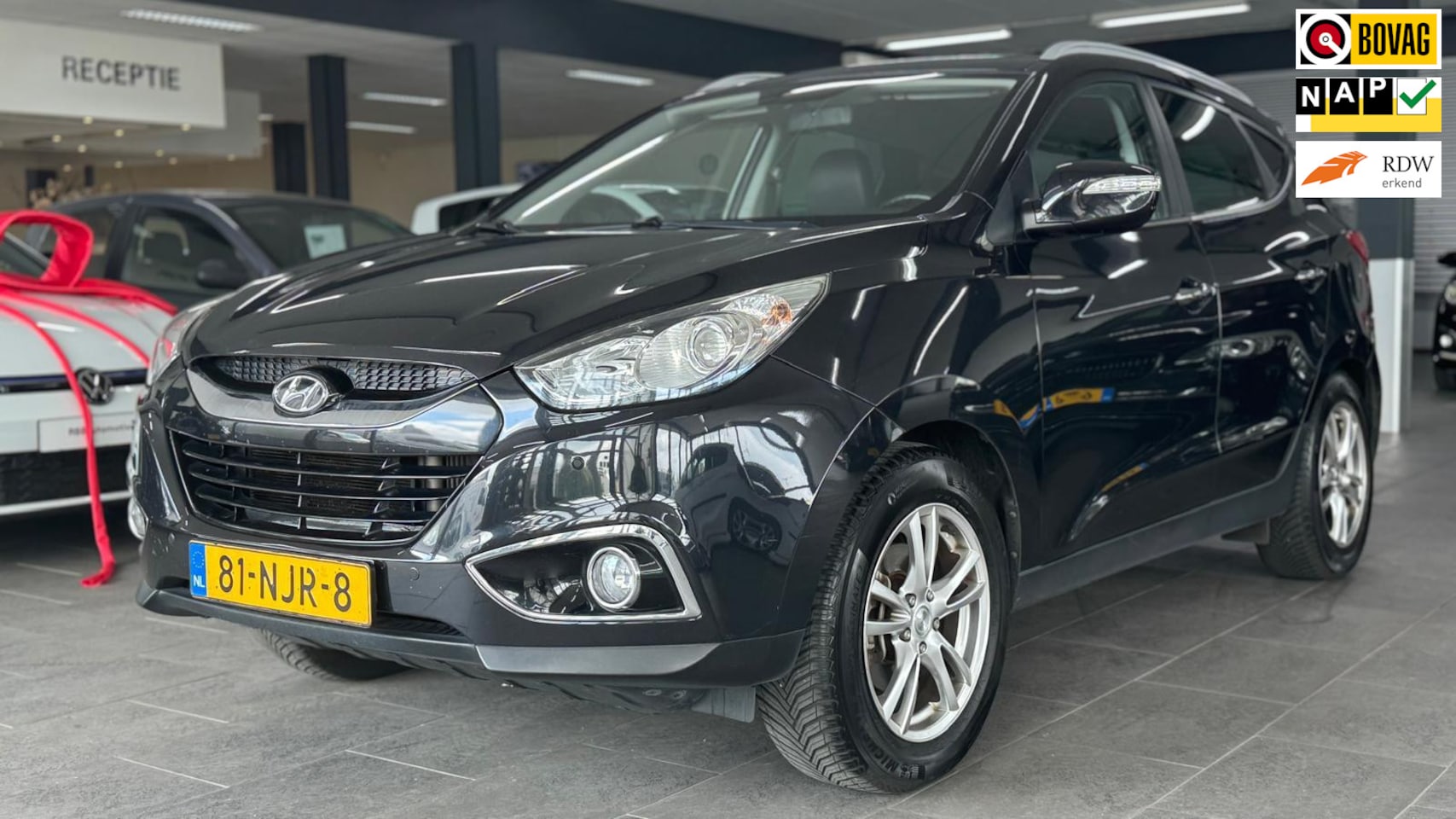 Hyundai ix35 - 2.0 CRDi HP 4WD Style automaat navigatie half leer clima cruise controle lm-velgen parkeer - AutoWereld.nl