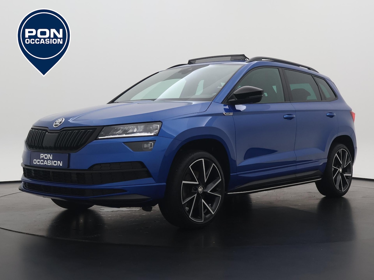 Skoda Karoq - 1.5 TSI ACT Sportline Business | Pano dak | Navigatie | ACC | Stoelverwarming | Parkeersen - AutoWereld.nl