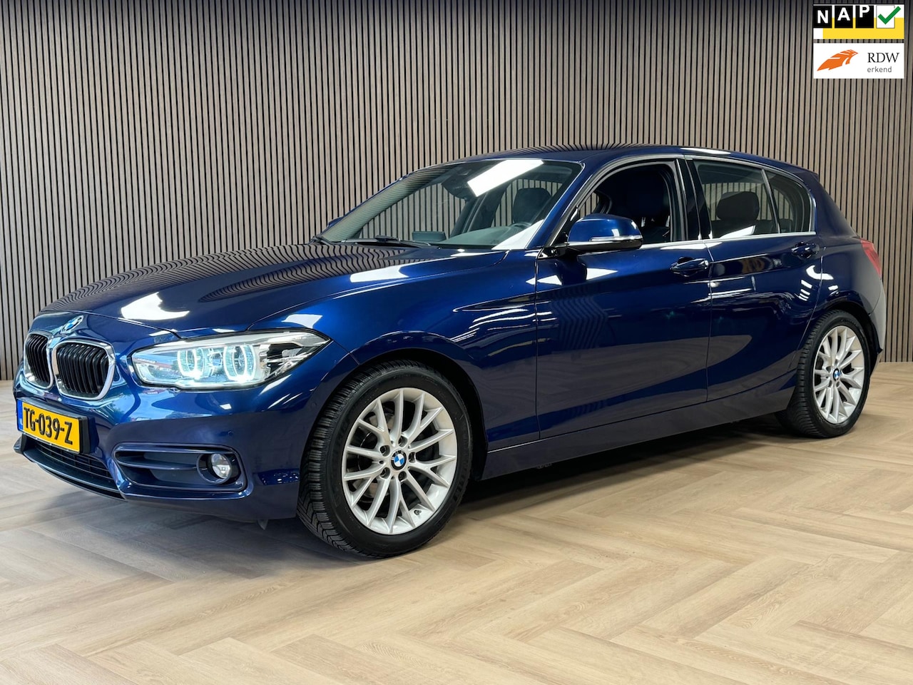 BMW 1-serie - 118i Centennial High Executive LPG G3 AUT. AIRCO CAMERA NAVI TREKHAAK LEDER KEYLESS - AutoWereld.nl