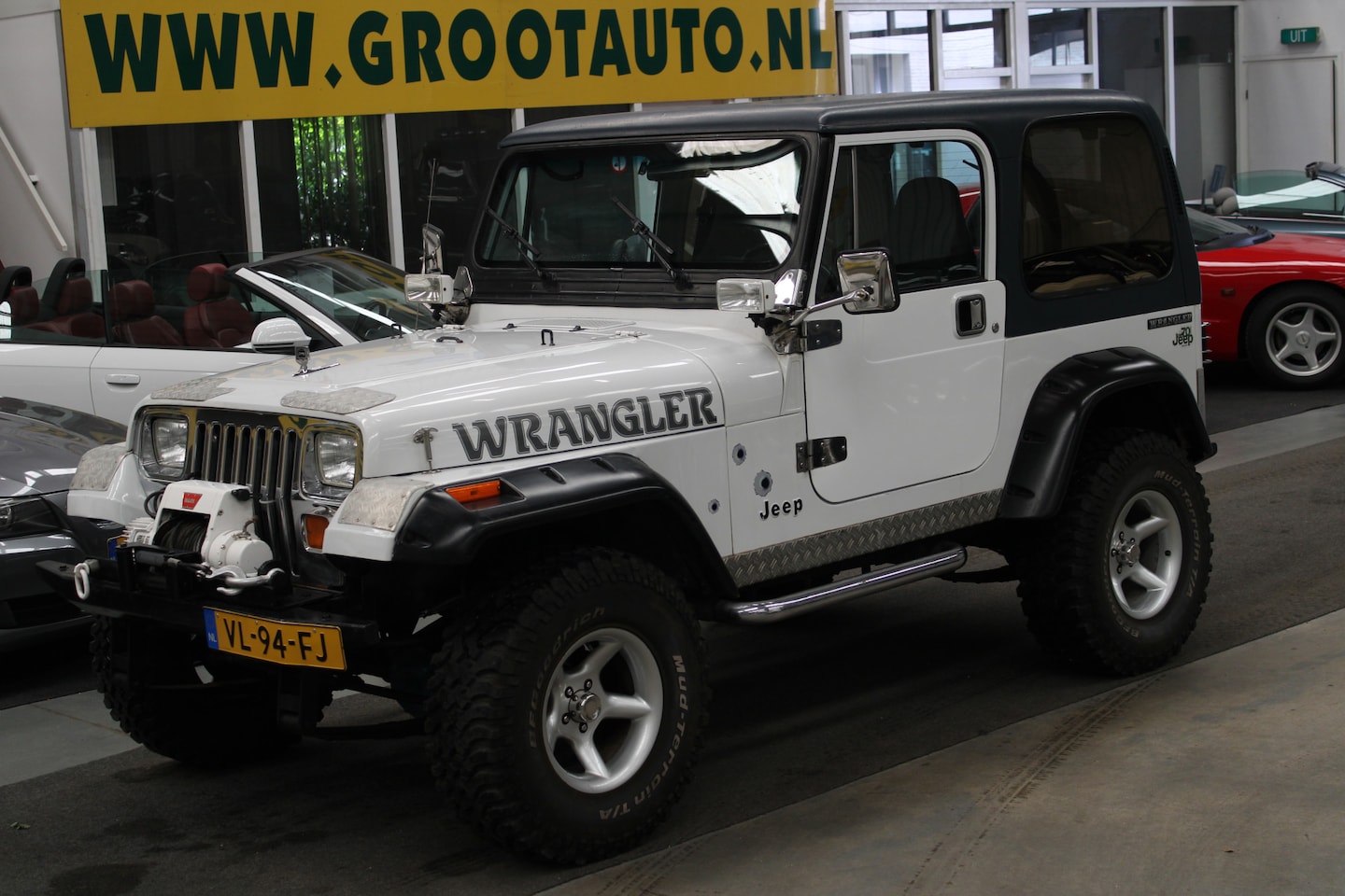 Jeep Wrangler - 2.5i Softtop 4x4, Tier, Stuurberkachtiging - AutoWereld.nl