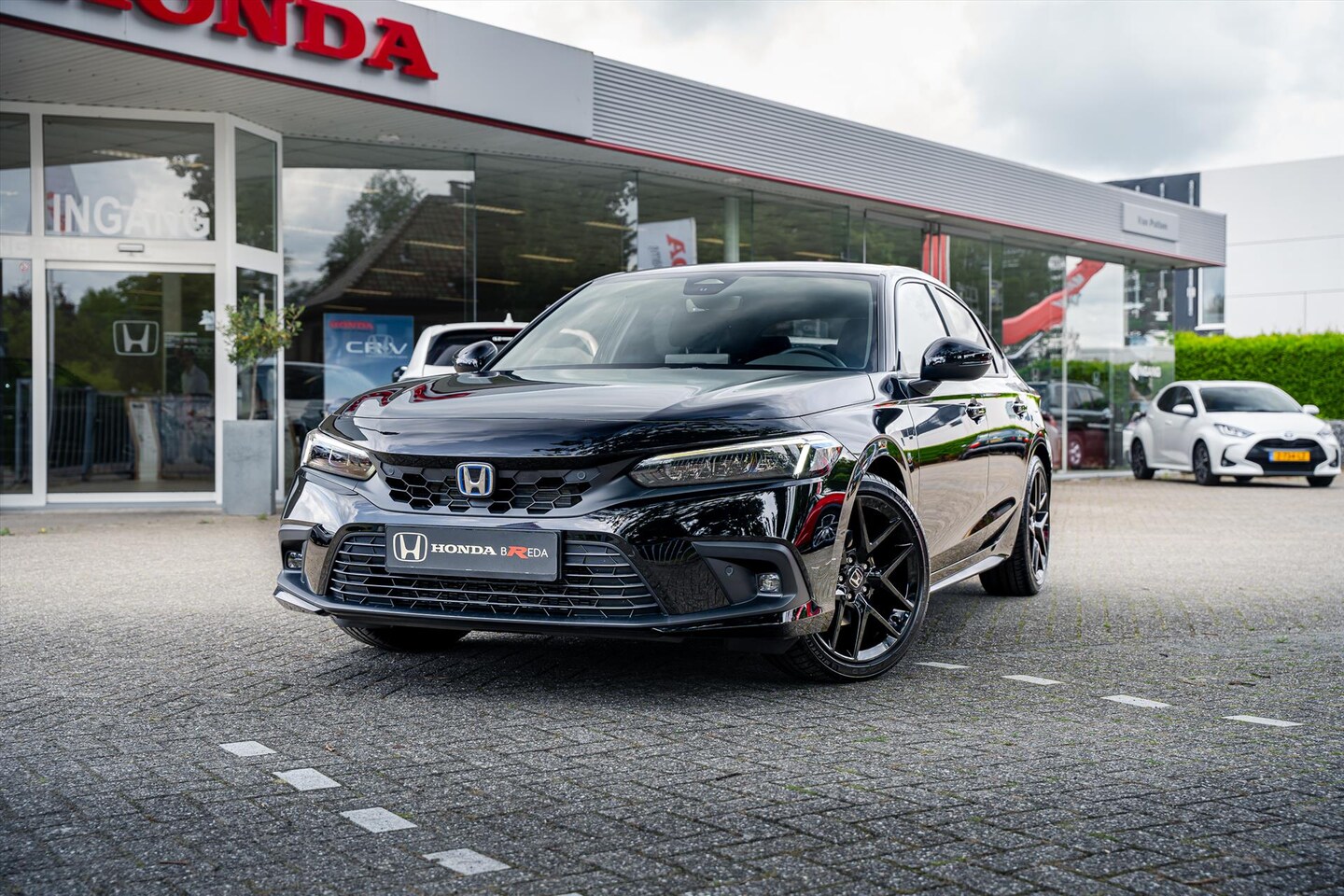 Honda Civic - 2.0 Sport | Full Hybrid | Nieuwe NL auto | 18 inch zwarte velgen | Draadloos opladen | Ada - AutoWereld.nl