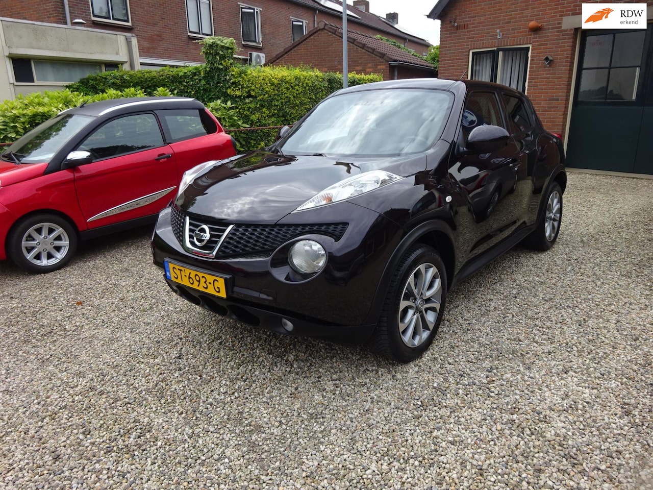 Nissan Juke - 1.6 Acenta Navigatie, Achteruitrijcamera, Leer, Lichtmetalen velgen - AutoWereld.nl