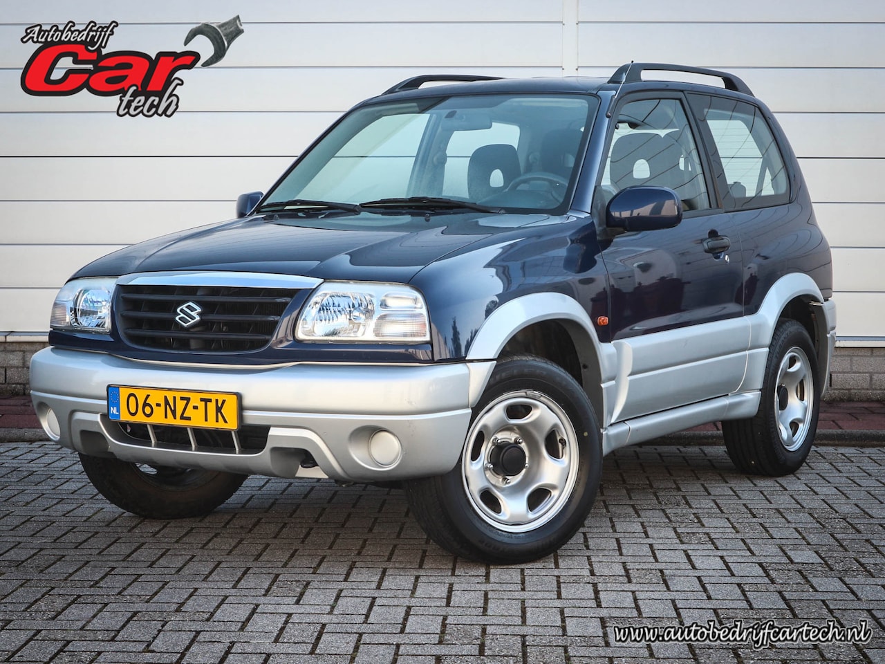 Suzuki Grand Vitara - 1.6 Metal Top Wide Body | Audio | Elektrische ramen | Two tone kleur | Centrale vergrendel - AutoWereld.nl