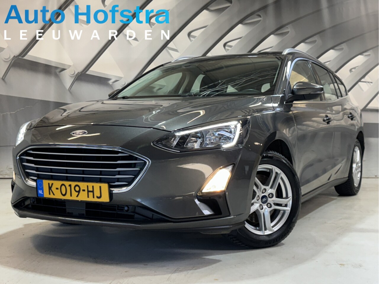 Ford Focus Wagon - 1.0 EcoBoost Titanium Business KEY-LESS NAVI CLIMA CAMERA TREKHAAK PDC LMV - AutoWereld.nl