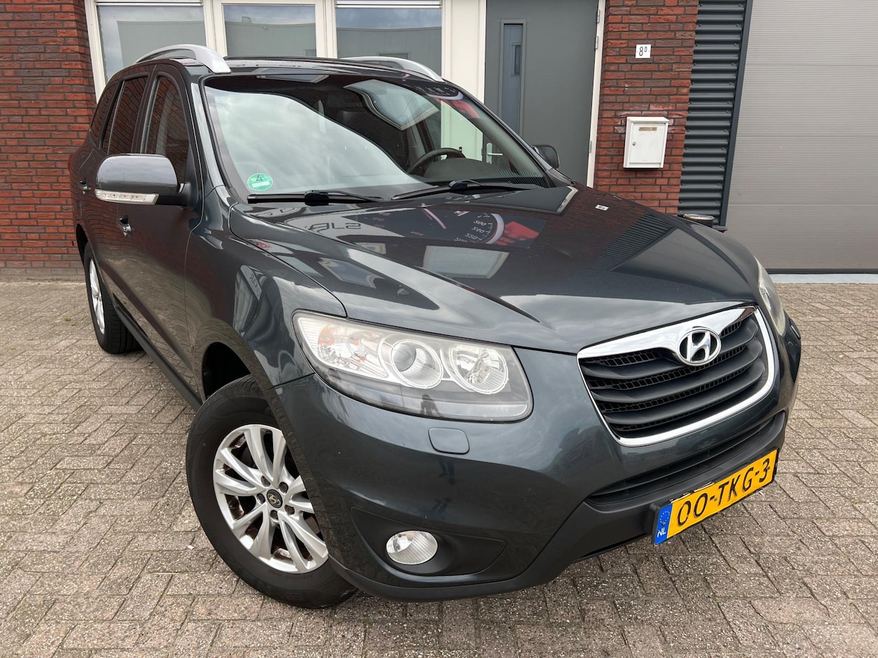 Hyundai Santa Fe - 2.4i CVVT 4WD Style / Airco / Cruise / Clima / Navi - AutoWereld.nl