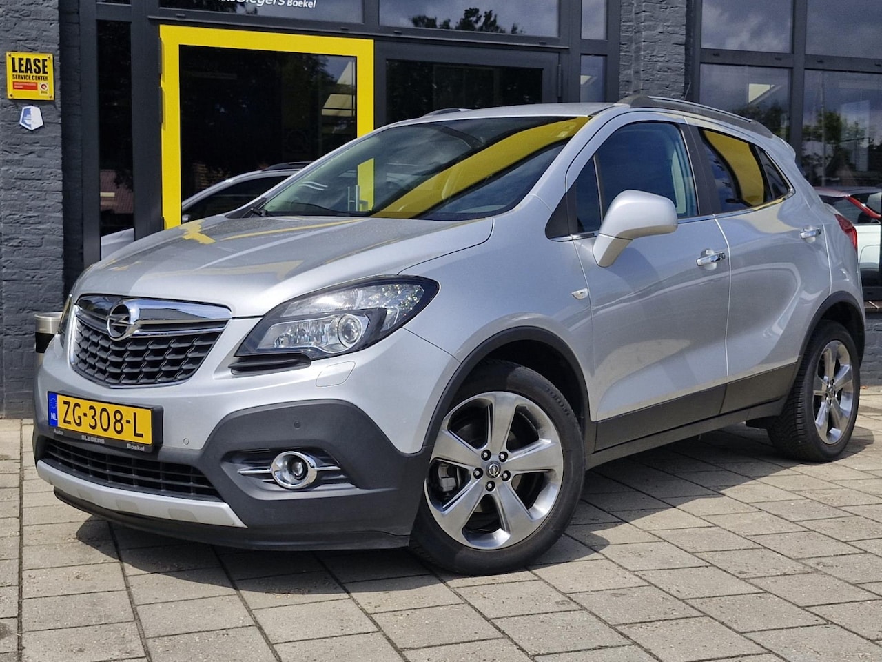 Opel Mokka - 1.4 Turbo Cosmo 4x4 140pk | Fietsenrek | Leder/stof | Stoel + stuurverw | Camera | Clima | - AutoWereld.nl