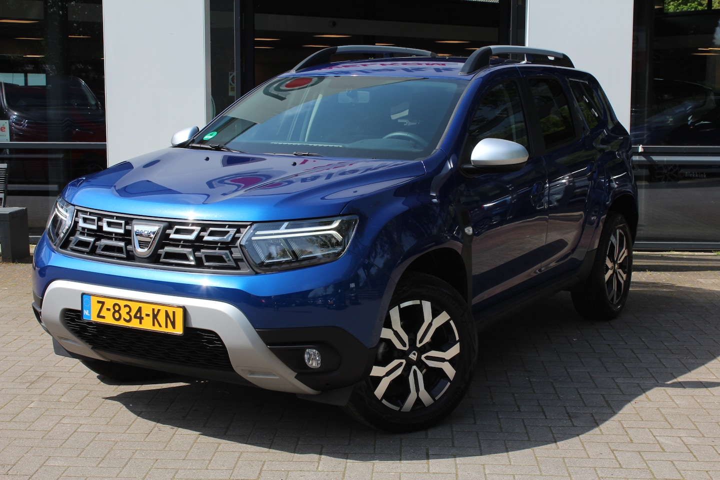 Dacia Duster - 1.3 TCe Prestige 130 pk Trekvrm: 1500KG PDC+ Camera, Clima, LMV, Apple Carplay/Android, Cr - AutoWereld.nl