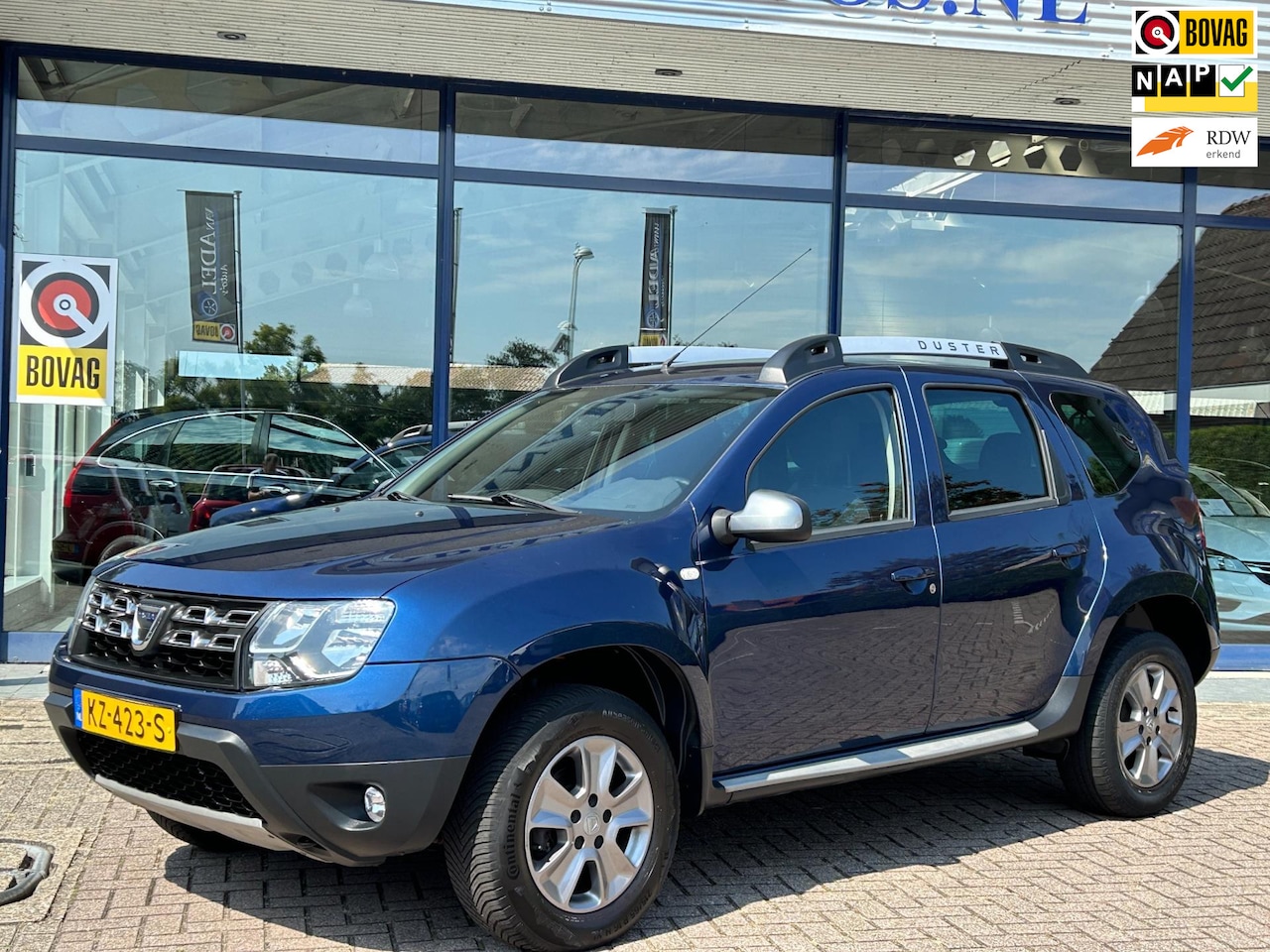 Dacia Duster - 1.2 TCe 4x2 Lauréate Navi Cruise Bluetooth Airco Park.Sens Trekhaak NAP NL-Auto Dealeronde - AutoWereld.nl