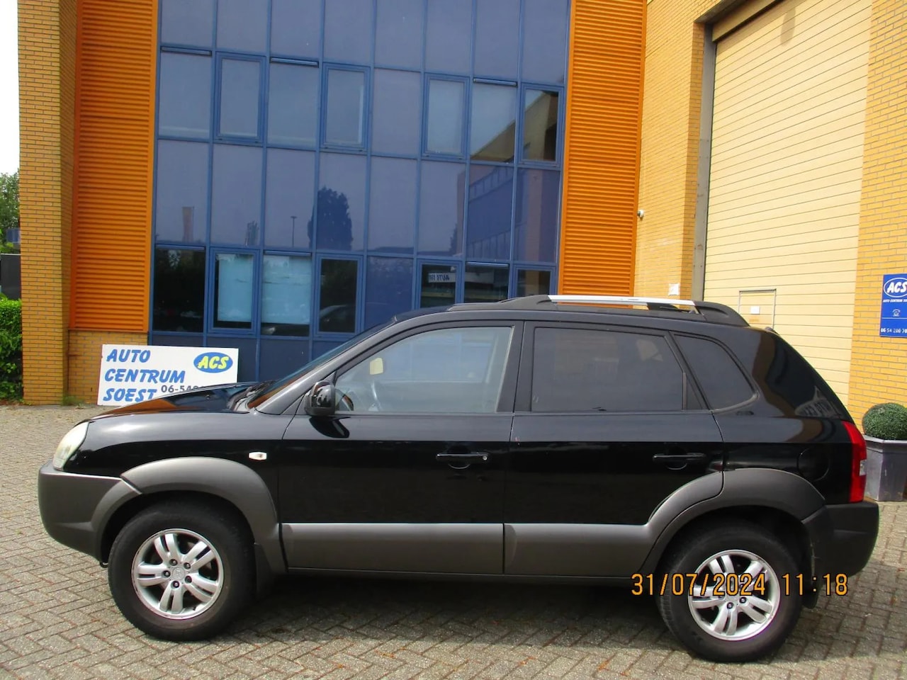 Hyundai Tucson - 2.0i Style Clima/LM - AutoWereld.nl