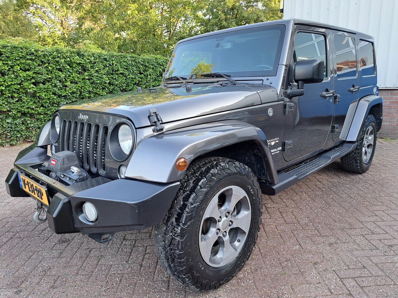 Jeep Wrangler - 2.8 CRD Sahara LEER/CLIMAT/CRUISE/NAVI/4WD LIER 200PK - AutoWereld.nl