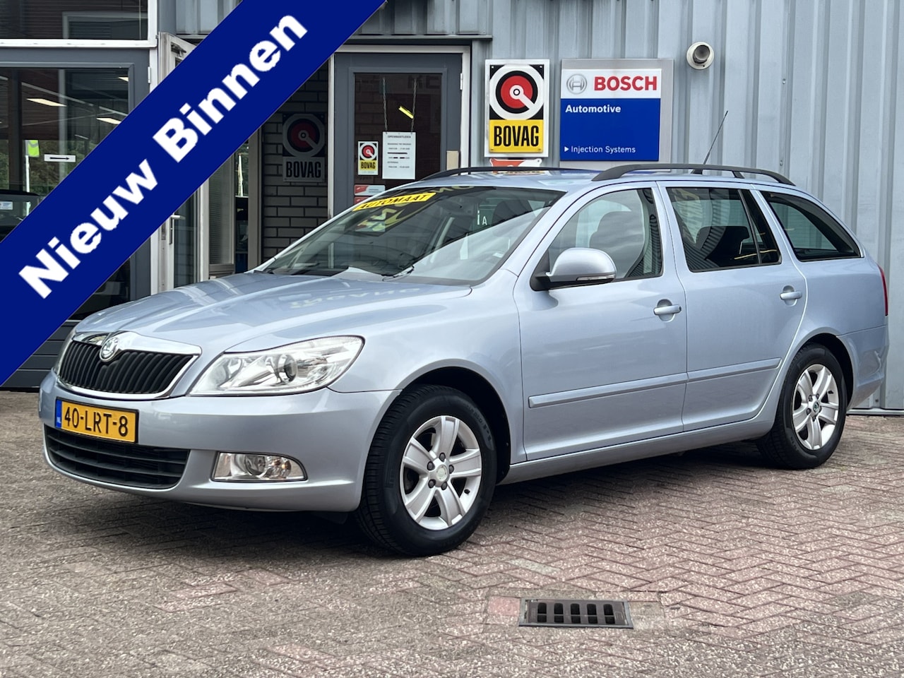 Skoda Octavia Combi - 1.2 TSI Ambition Business Line | AUTOMAAT | NAVIGATIE | TREKHAAK | CRUISE CONTROL | - AutoWereld.nl