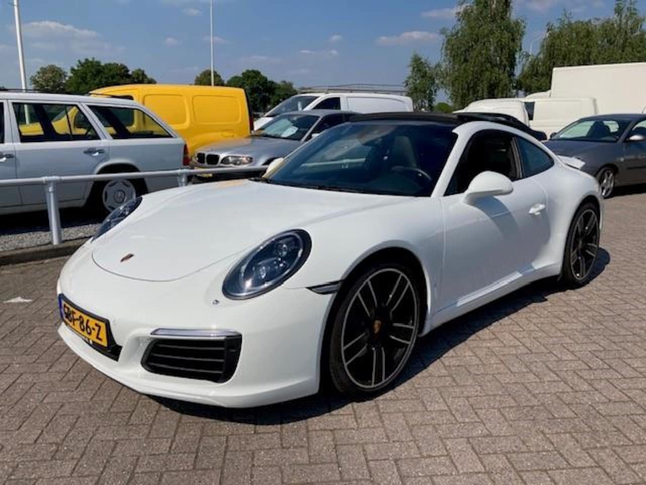 Porsche 911 - 991.2 3.0 Carrera schuif-kanteldak sportuitlaat - AutoWereld.nl