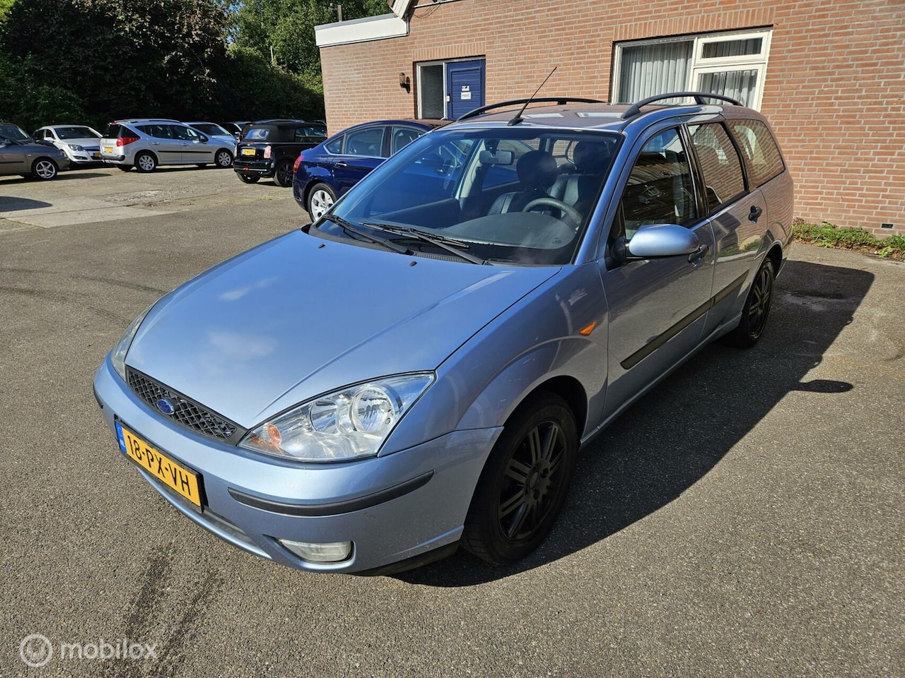 Ford Focus Wagon - 1.6-16V Ghia 1.6-16V Ghia - AutoWereld.nl