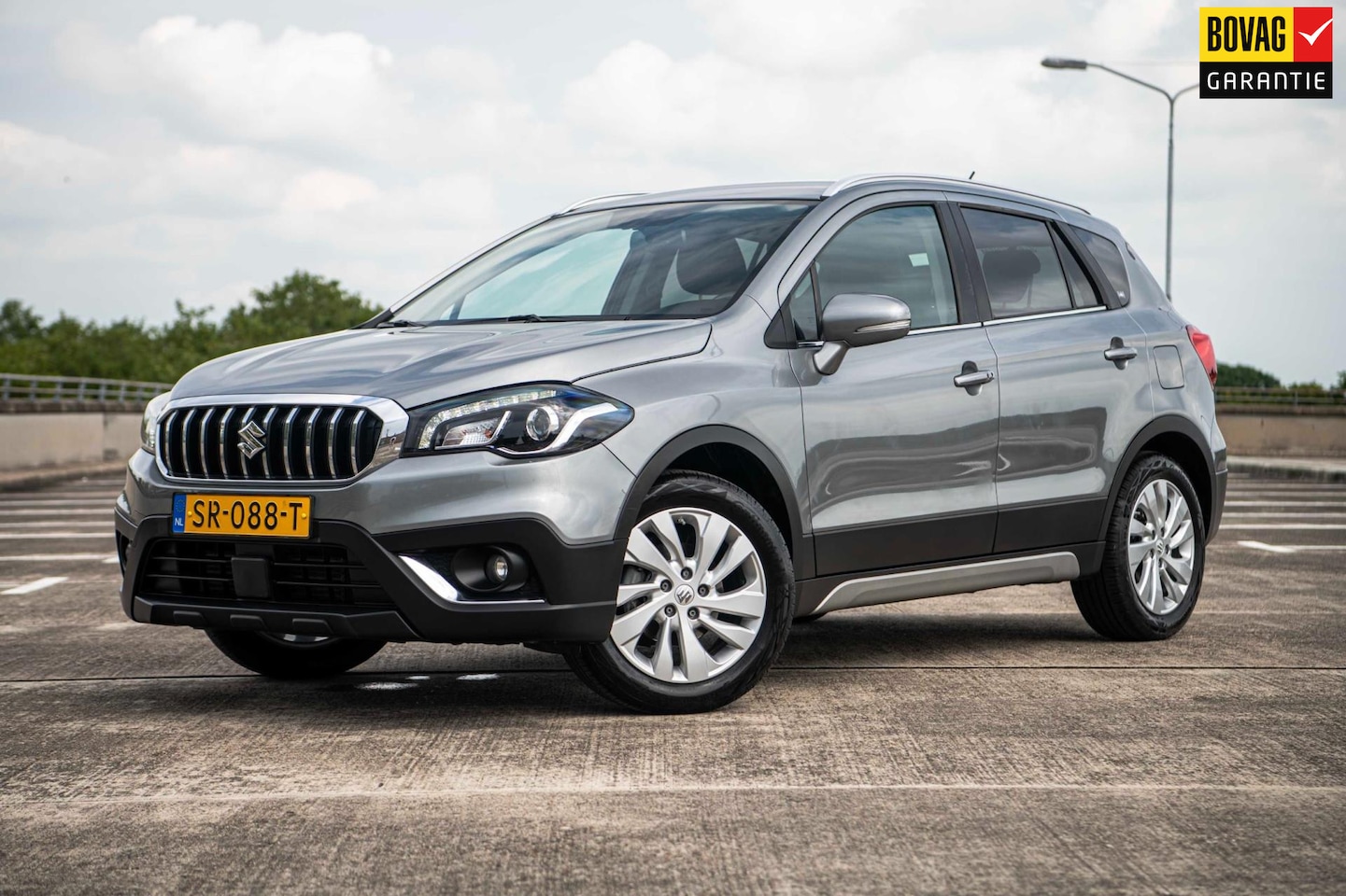 Suzuki S-Cross - 1.0 111pk Boosterjet Exclusive Automaat | Afn. trekhaak| Clima | Cruise | Hoge instap - AutoWereld.nl