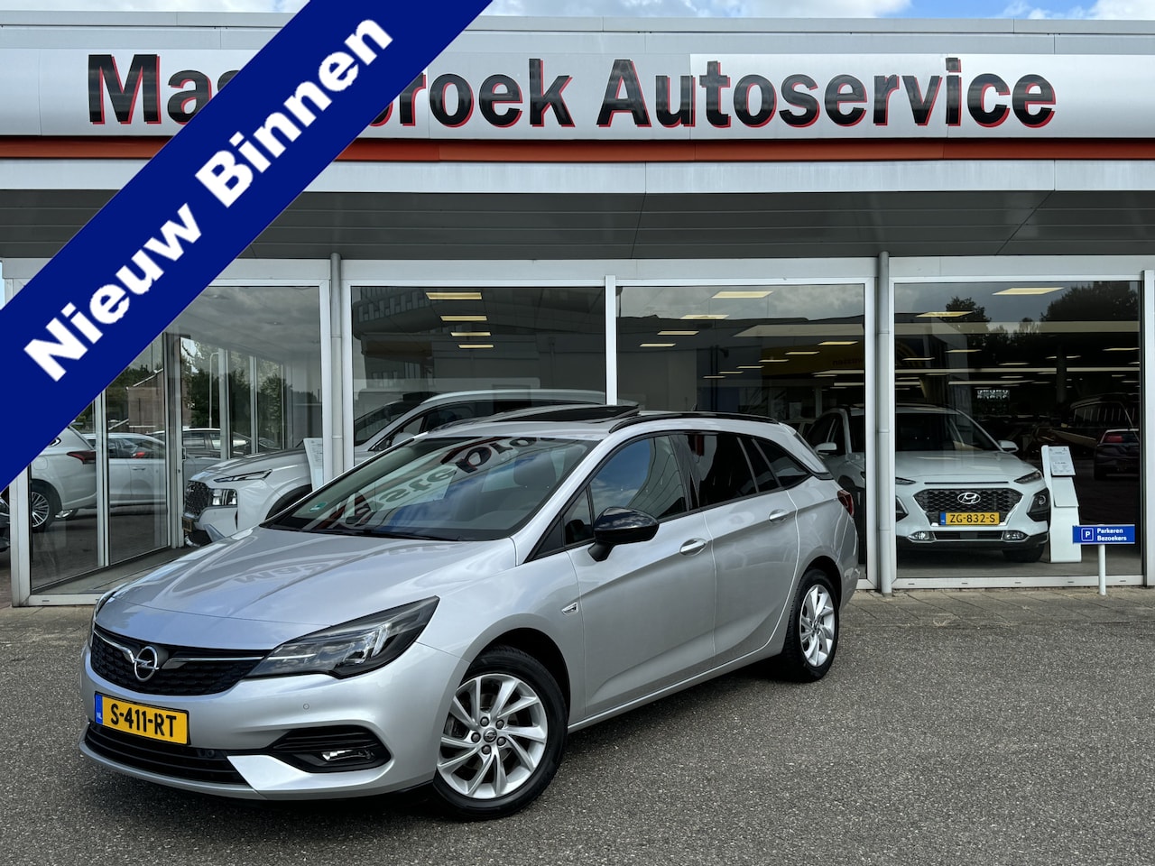 Opel Astra Sports Tourer - 1.2 Blitz Elegance Schuif kanteldak Staat in Hardenberg - AutoWereld.nl