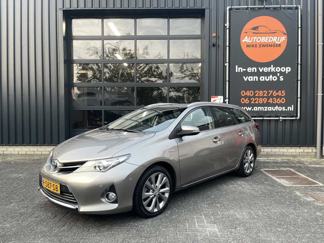 Toyota Auris - 1.8 Hybrid Sport NAVIGATIE|CAMERA|HALF LEER|STOELVERWARMING|KEYLESS ENTRY - AutoWereld.nl