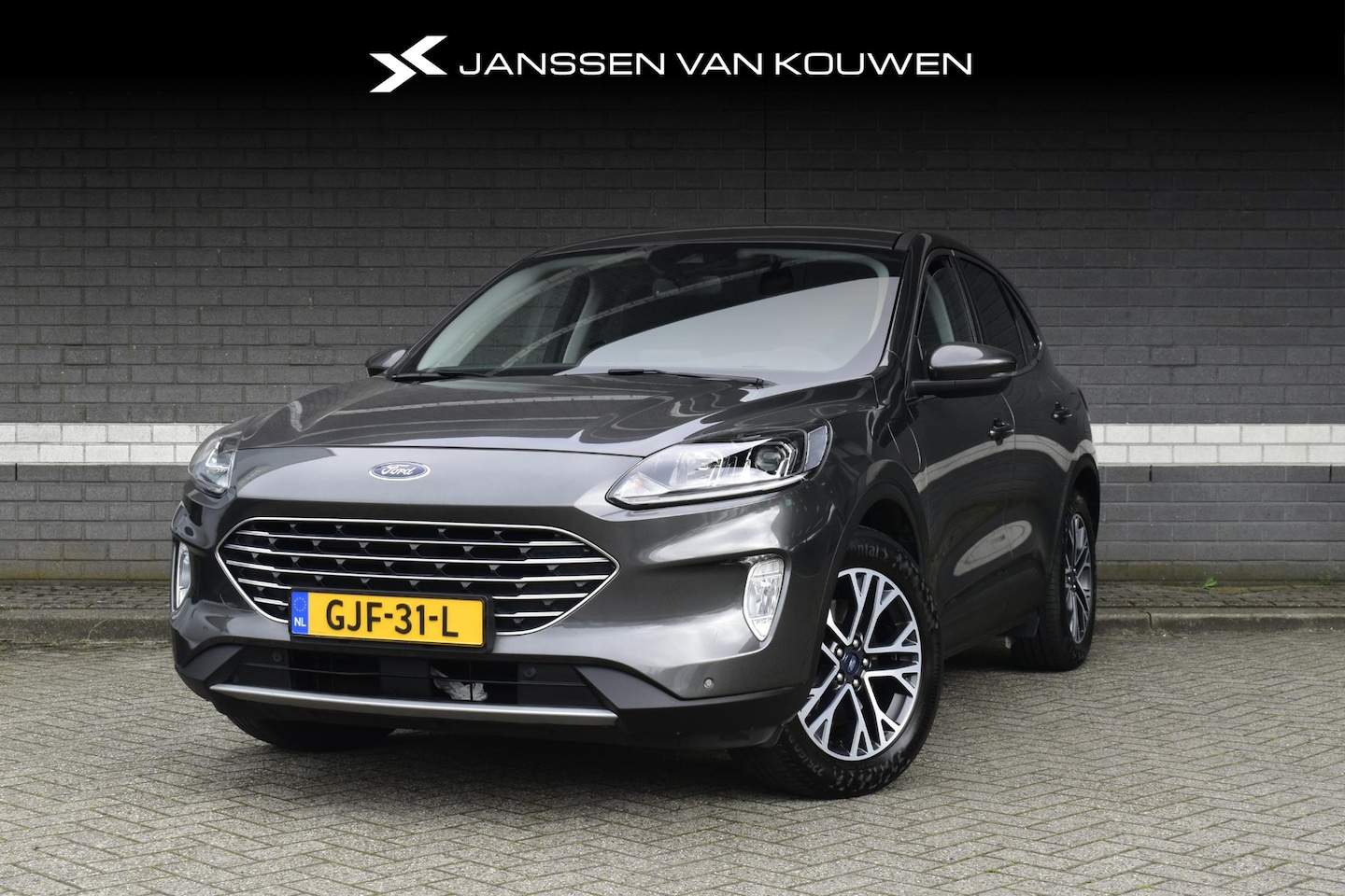 Ford Kuga - 2.5 PHEV Titanium / Navi / Carplay / Keyless / Achterklep elektrisch - AutoWereld.nl