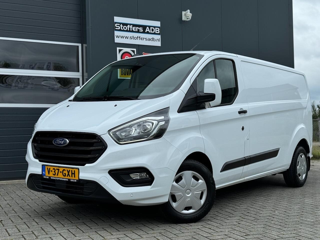 Ford Transit Custom - 320 2.0 EcoBlue 130pk L2H1 Trend | Navi | Camera | BLIS | Winterpack | Airco | Cruise | Be - AutoWereld.nl