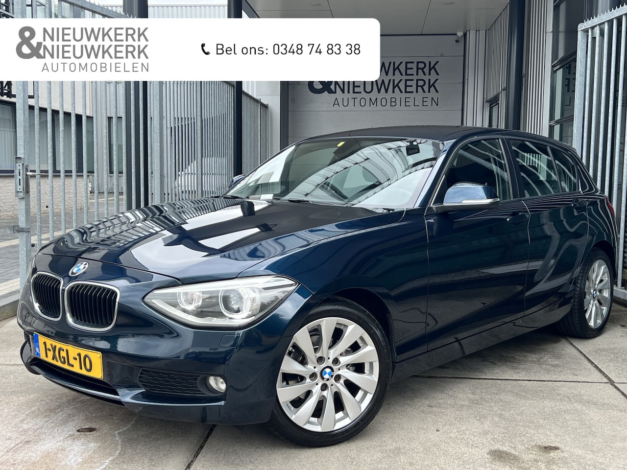 BMW 1-serie - 116i Executive 5 Deurs | AUTOMAAT | TREKHAAK | NAVI | PDC | CRUISE CONTROL | CLIMATE CONTR - AutoWereld.nl